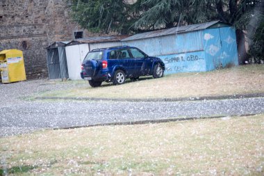 hailstones after strong wind and ice storm in parking high quality photo  clipart