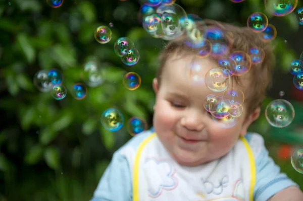 Small Child Playing Soap Bubbles High Quality Photo Stock Image