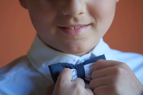 Boy Fastens His Bow Tie First Communion High Quality Photo — Stock Fotó