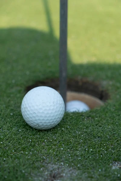 ball on the golf course near the hole. High quality photo