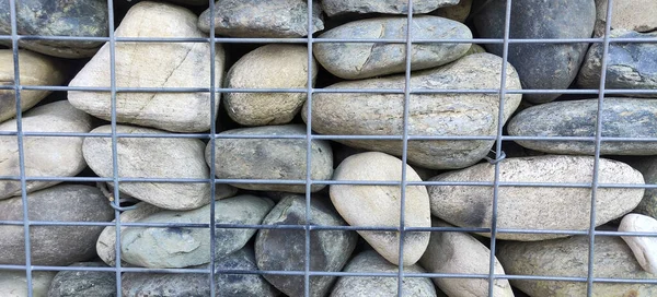 river rock walls in metal cages. High quality photo