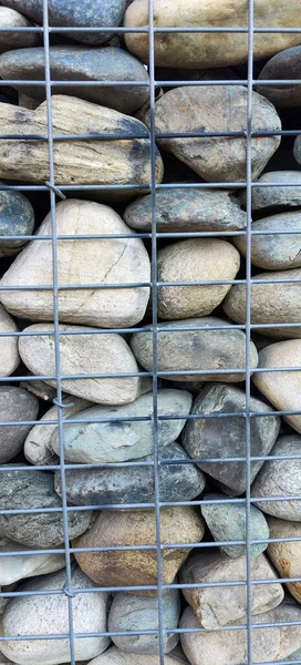 river rock walls in metal cages. High quality photo