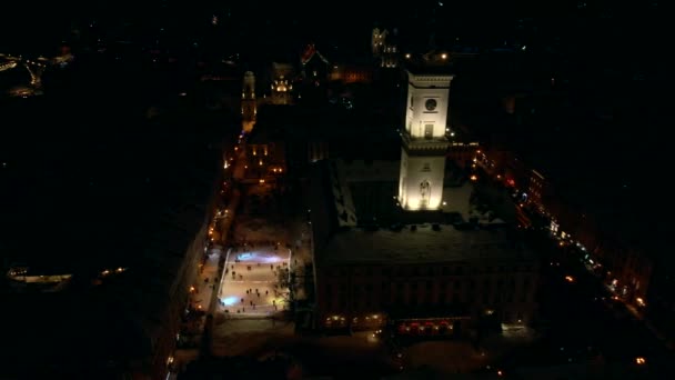 Aerial view of night city with ski rink — Stock Video