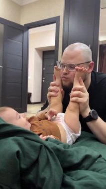 Cute Playful moment between father and baby