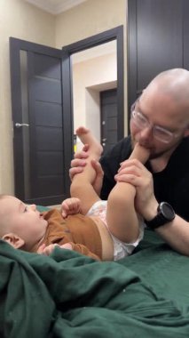 Cute Playful moment between father and baby