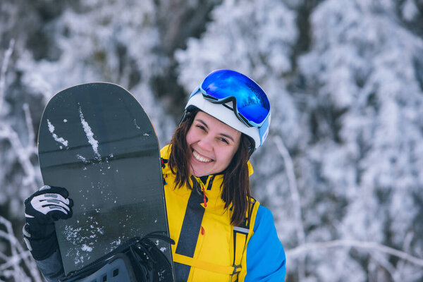 pretty woman snowboarder portrait winter activities