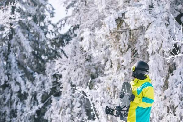 man in ski equipment with snowboard winter leisure activities
