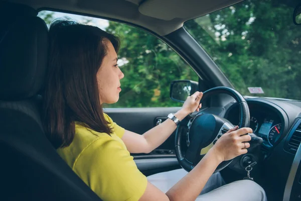 woman driving car with navigation on the phone. copy space