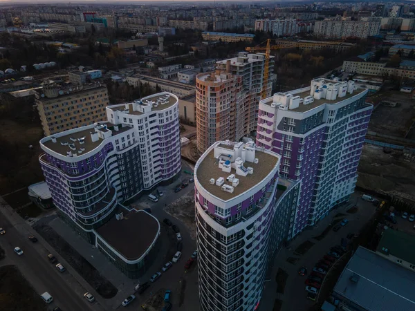 aerial view of apartment construction site with crane city development