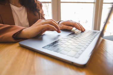 woman working on the laptop in cafe copy space freelancer