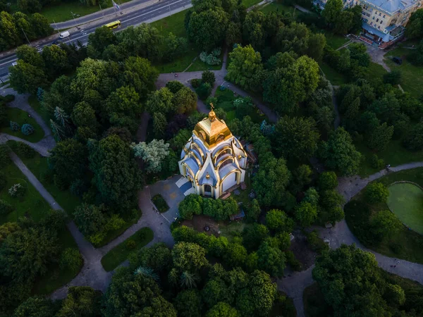 stock image christian church with golden dome in green summer park aerial view