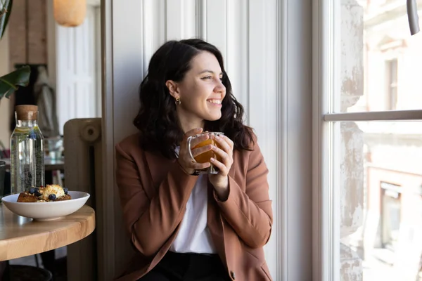 Smiling Woman Sitting Cafe Drinking Tea Looking Window Copy Space — Stock Photo, Image