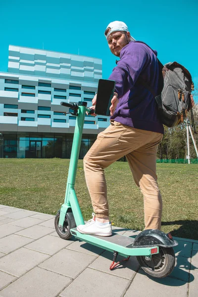 renting electric kick scooter city urban transport last mile ride copy space