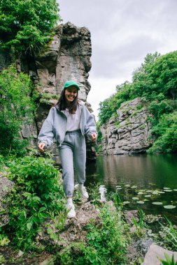 hiker woman enjoying view of river in canyon