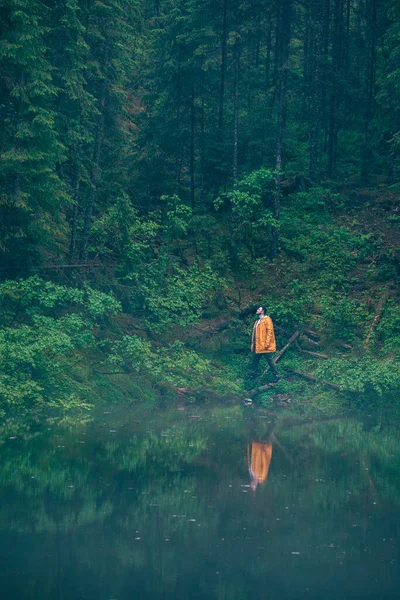 Man Hiker Yellow Raincoat Looking Mountain Lake Traveler Concept Copy — Stock Photo, Image