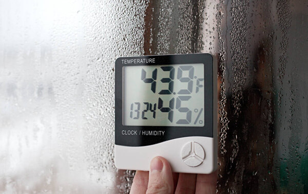 Humidity indicator is indicated on the hygrometer of the device. An image of electronic device to check temperature and humidity in closed area