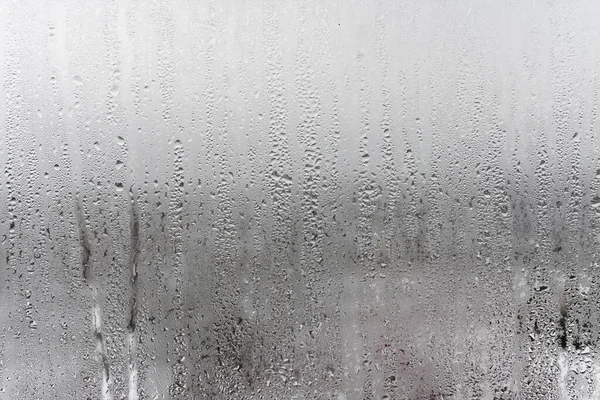 Närbild Vatten Droppe Grå Bakgrund Mistat Glas Med Droppar Vatten — Stockfoto