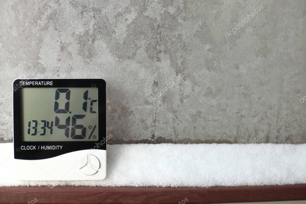 An electronic thermometer and hygrometer for temperature and humidity control is installed on the snow. The humidity indicator is indicated on the hygrometer of the device