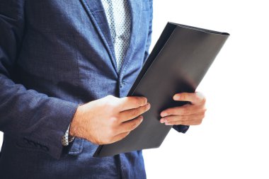 Businessman holding a black folder in hands clipart
