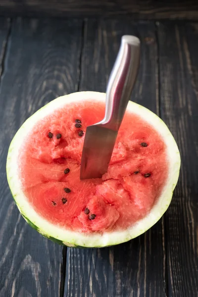 Knife in watermelon on background — Stock Photo, Image