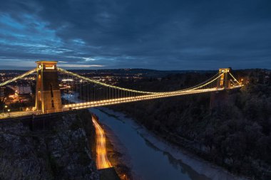 Clifton Suspension Bridge at sunset, with light trails from the vehicles.