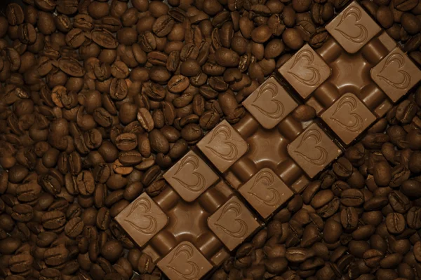 Chocolates in coffee beans. — Stock Photo, Image