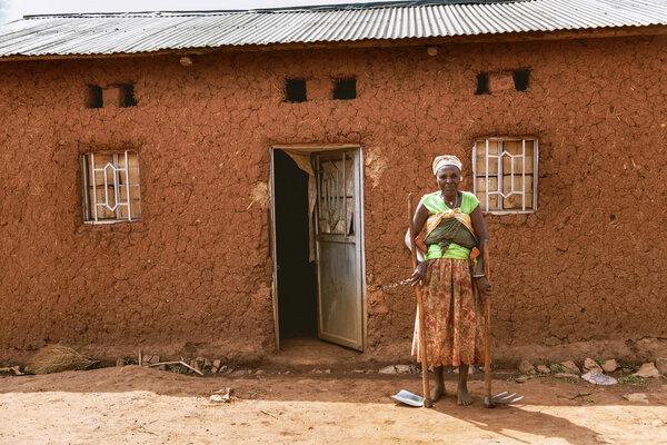 The woman with pickaxe and shovel on her hands is barefoot.