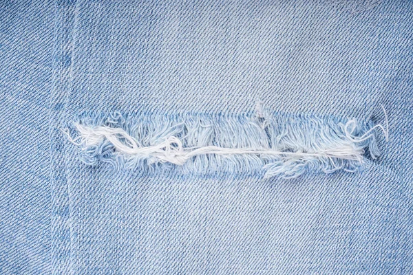 Gescheurde Jeans Blauwe Denim Textuur Gescheurde Stijlvolle Broek Moderne Denim — Stockfoto