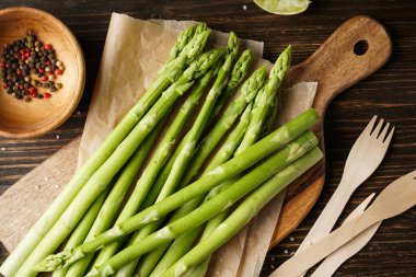 Fresh asparagus on wooden background, close-up. Top view