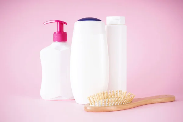 Composition Shampoo Bottles Soap Dispenser Wooden Hairbrush Pink Background — Stock Photo, Image