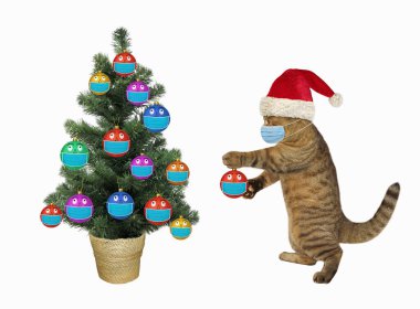 A cat in a Santa Claus hat decorates the Christmas tree with colored balls in protective masks. White background. clipart