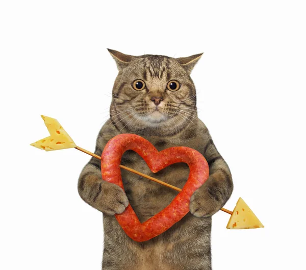 Eine Beige Katze Hält Eine Herzförmige Wurst Der Hand Die — Stockfoto