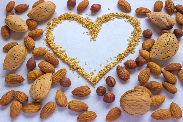 Symbol - the heart, consisting of sesame. Around a variety of nuts- walnuts, almonds