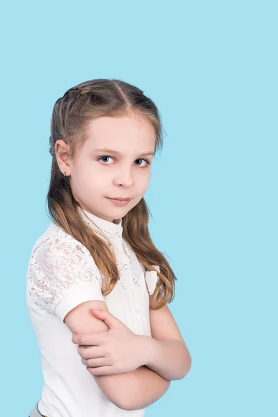 Portrait of cute teenager girl, isolated on blue — Stock Photo, Image