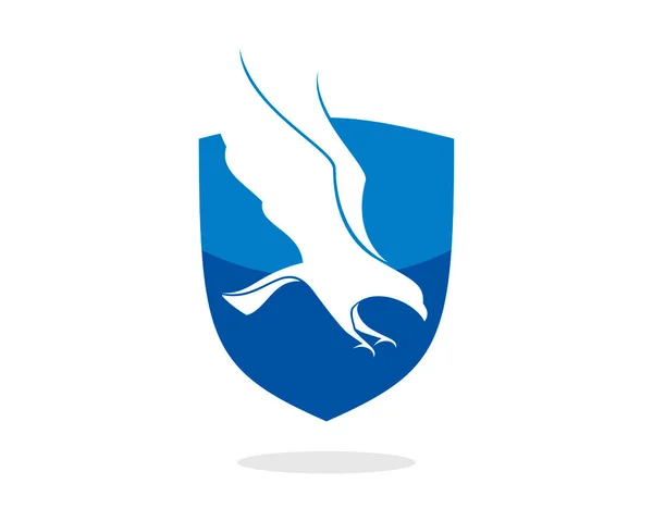 Escudo Azul Con Águila Voladora Dentro — Vector de stock