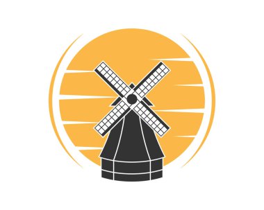 Arkasında günbatımı manzaralı yel değirmeni çiftliği