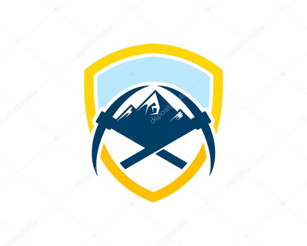 Shield with cross mining axe and mountain inside