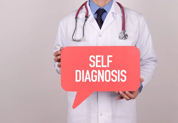 Doctor holding speech bubble — Stock Photo, Image