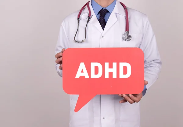 Doctor holding speech bubble — Stock Photo, Image