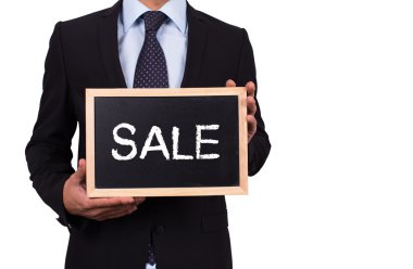 Mini yazı tahtası tutan işadamı