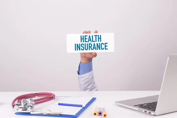 Doctor holding placard — Stock Photo, Image