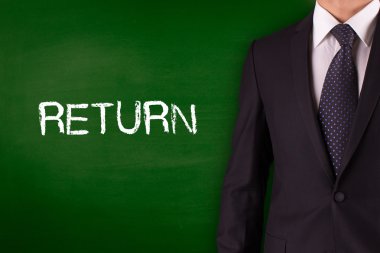 Blackboard karşı ayakta işadamı