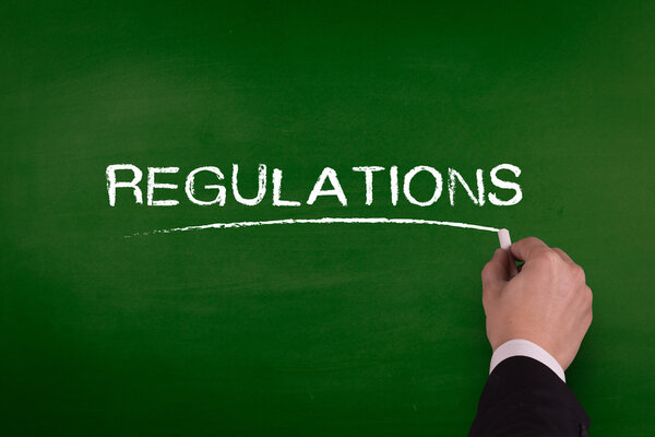 business man writing regulations
