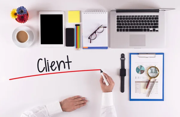 Businessman writing with marker on desk — Stock Photo, Image