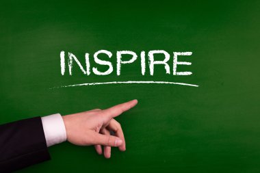 Üzerinde işaret eden işadamı ilham