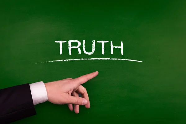 Businessman pointing on truth — Stock Photo, Image