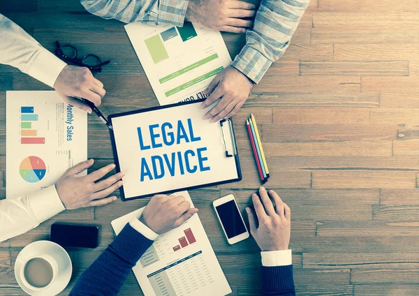 Business team sitting on table — Stock Photo, Image