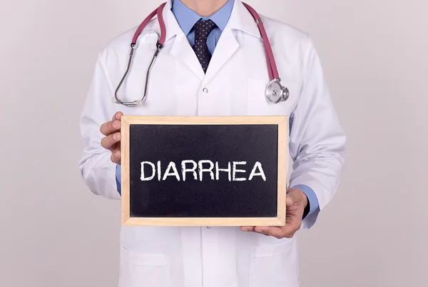 Doktor drží mini tabule — Stock fotografie