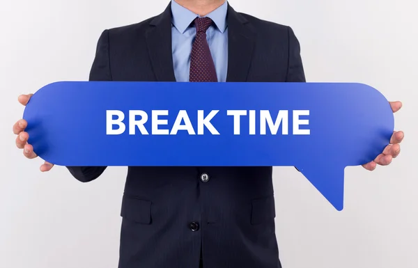 Businessman holding speech bubble — Stock Photo, Image