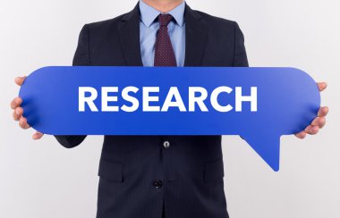 konuşma balonu tutan işadamı